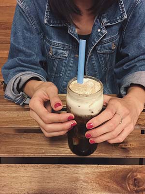 girl holding boba drink